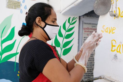 An Indian female washing her hands during the COVID-19 pandemic