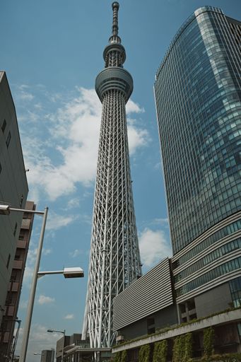 A striking image of the Tokyo Skytree tower standing tall against the backdrop of a bright blue sky