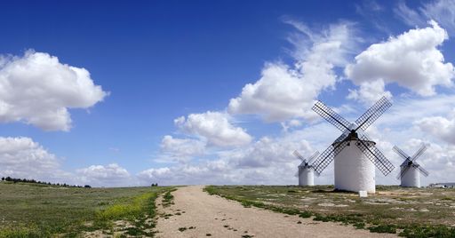 A beautiful scenery of  windmills by the road in Campo de Criptana, Spain