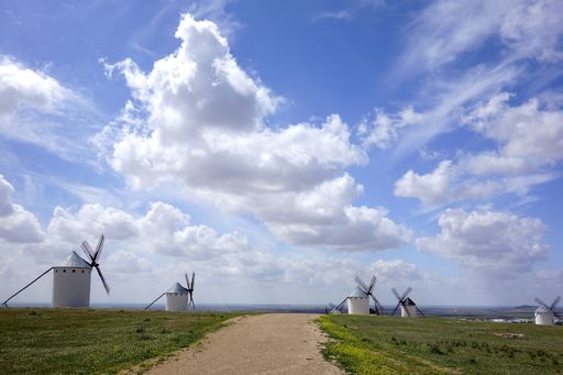 A beautiful scenery of  windmills by the road in Campo de Criptana, Spain
