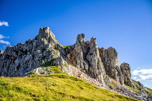 A beautiful shot of rocky mountains under a bright sky