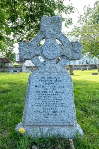 A vertical closeup of an old gravestone in a cemetery of Winchelsea, UK