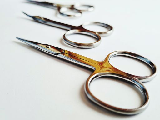 A closeup shot of metal nail scissors isolated on white background