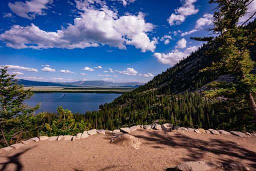 A scenic view of Jenny Lake in Grand Teton National Park, Wyoming in the summertime.