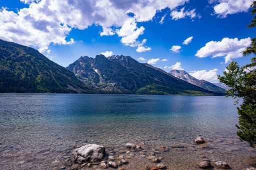 A scenic view of Jenny Lake in Grand Teton National Park, Wyoming in the summertime.