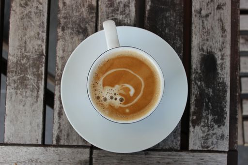 A top view of fresh coffee on wooden planks