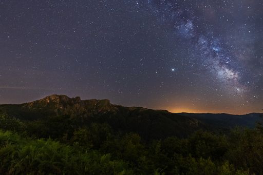An aerial shot of Milky way over the top of mountain Penas de Aya in Oiartzun in Spain