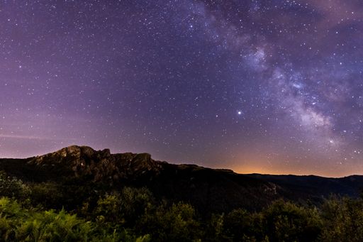 An aerial shot of Milky way over the top of mountain Penas de Aya in Oiartzun in Spain