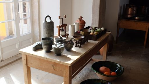 A closeup shot of old instruments and antique items on a wooden table