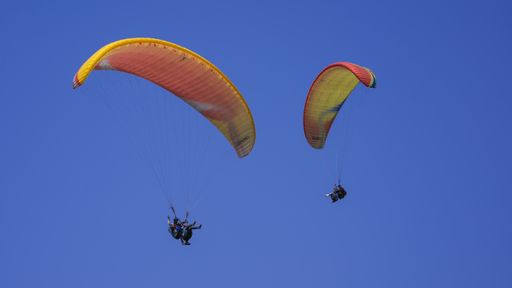 People paragliding in Pokhara for adventure
