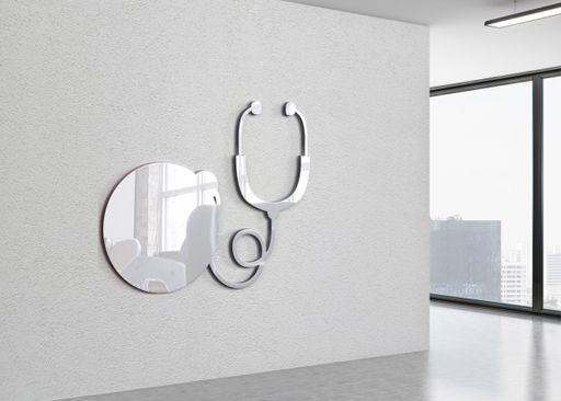 A closeup shot of a decorative mirror on the white wall as a room interior