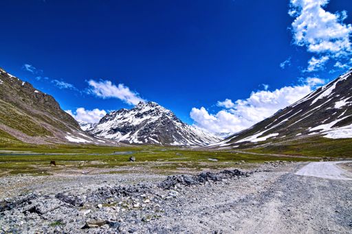The mesmerizing views of the snowy landscapes against the cloudy sky captured from the car
