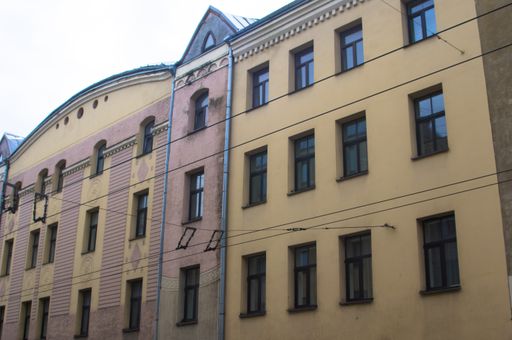 A low angle shot of a building's facade on a gloomy day