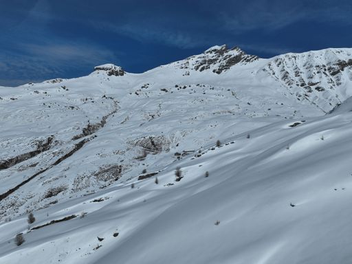 Majestic view of a snow-covered mountain range in the Swiss Alps during winter