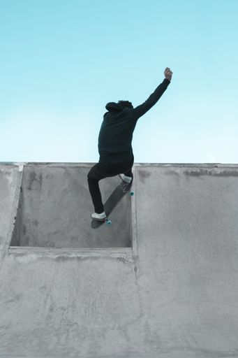 A male doing exhibition on skateboarding ring without a skateboard