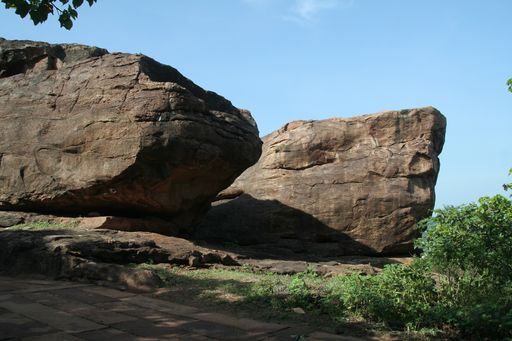 A closeup shot of smooth textured twin rocks in the bright morning sunlight