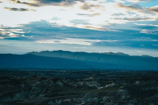 A valley under the cloudy sunset sky at the Tatacoa Desert, Colombia