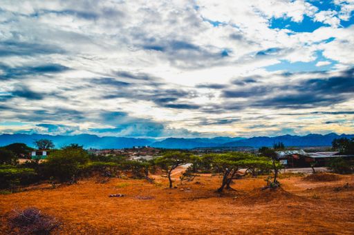 The cloudy sky over the valley with wild plants at the Tatacoa Desert, Colombia at sunset