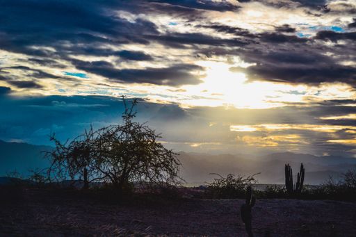 The sun shining behind the clouds over the Tatacoa Desert, Colombia
