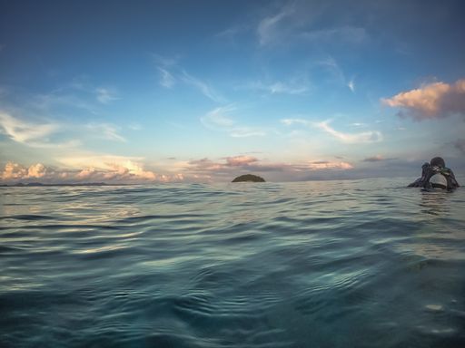 The blue sea and cloudy sky during sunset