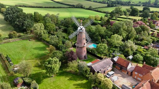 An aerial view of the Quainton Windmill and nearby rural areas in the United Kingdom