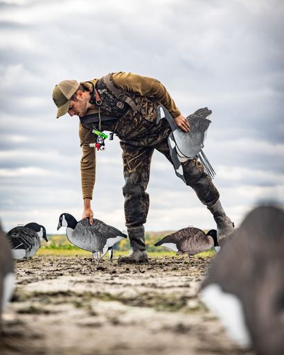 A vertical shot of a professional waterfowl hunter in Minnesota on a season opener