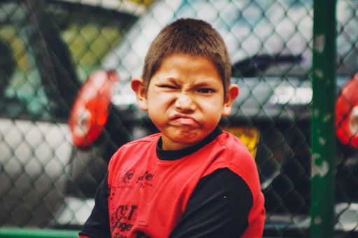 Photograph taken in the streets of Bogotá to a grumpy boy.