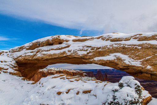 A beautiful shot of the Mesa Arch in snow in Canyonlands, Utah