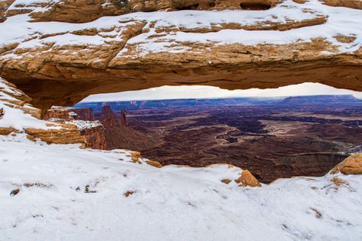 A beautiful shot of the Mesa Arch in snow in Canyonlands, Utah