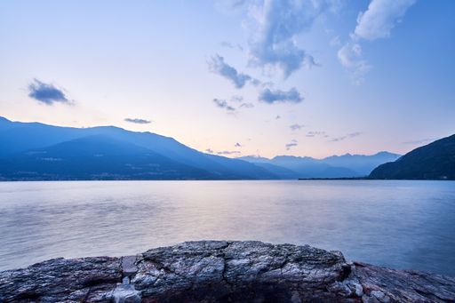 A beautiful shot of a sunset sky over Lake Como and nearby mountains
