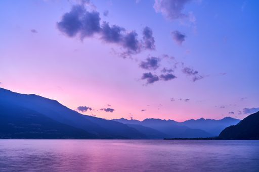 A beautiful shot of a sunset sky over Lake Como and nearby mountains