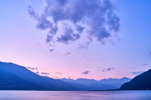 A beautiful shot of a sunset sky over Lake Como and nearby mountains