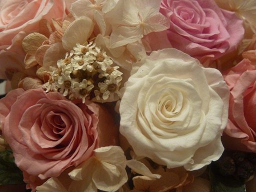 An overhead shot of an artificial floral design of different colors