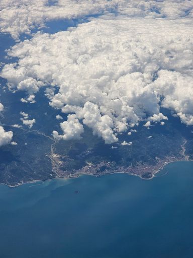 An aerial view of clouds above Trabzon city against the sea in Turkey