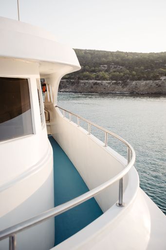 A vertical of the sea seen from a white boat on a sunny day in Akamas, Cyprus