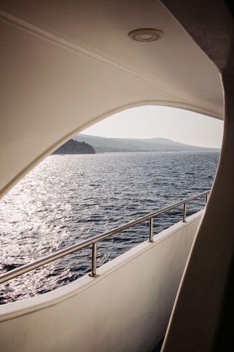 A vertical of the sea seen from a white boat on a sunny day in Akamas, Cyprus