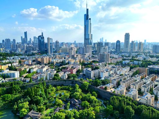An aerial view of the bustling city of Shenzhen, China, from a high vantage point, showcasing the modern architecture and vibrant cityscape