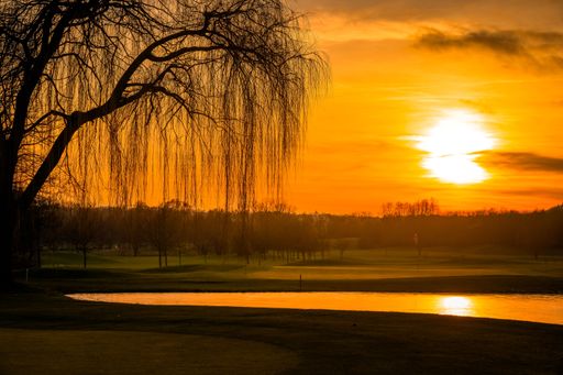 A gorgeous sky painted in brilliant orange hues as the sun begins to set