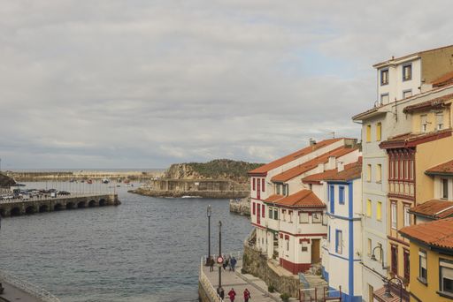 The beautiful scene of coastline and buildings in La Taberna del Puerto, Asturias, Spain
