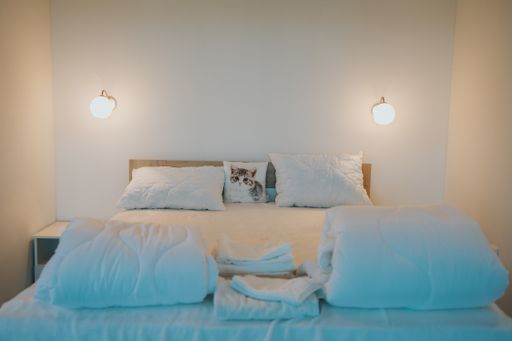 A closeup shot of a made-up bed