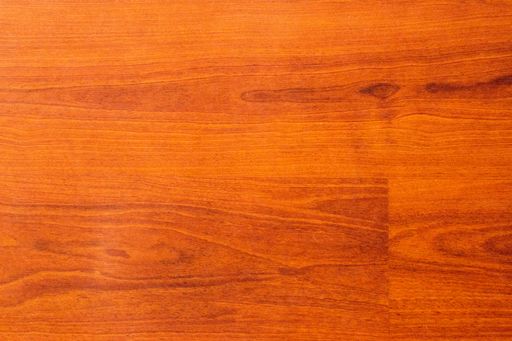 A high angle shot of a shiny plywood floor