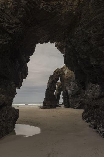 A vertical shot of the beach in the Province of Galicia, Spain during daylight