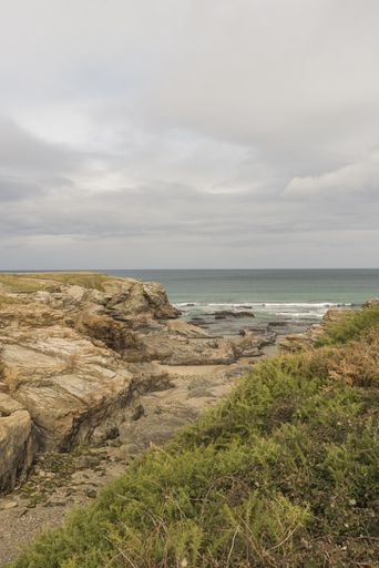 A vertical shot of a rocky seashore in the province of Galicia, Spain