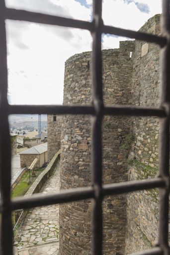 A vertical shot of the view from the window of the ancient castle of Ponferrada, Leon, Spain