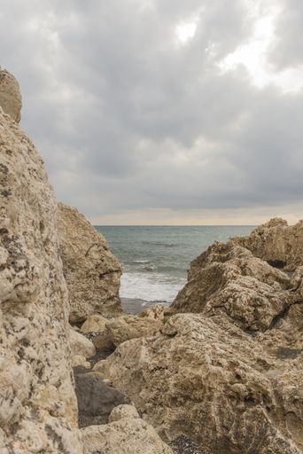 A vertical shot of the calm beach in Malaga, Andalucia, Spain during daylight