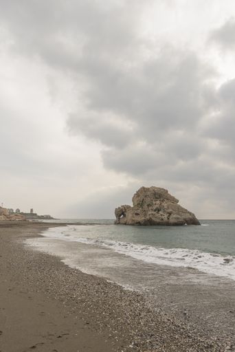 A view of the Playa Penon del Cuervo beach on a gloomy day in Malaga, Andalucia, Spain