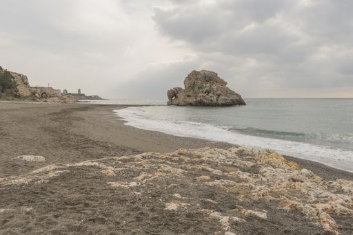 A closeup shot of a big rock on the beach of Malaga, Andalucia, Spain