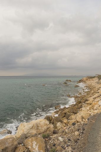 A vertical shot of the ocean and rocky beaches of Malaga, Andalucia, Spain
