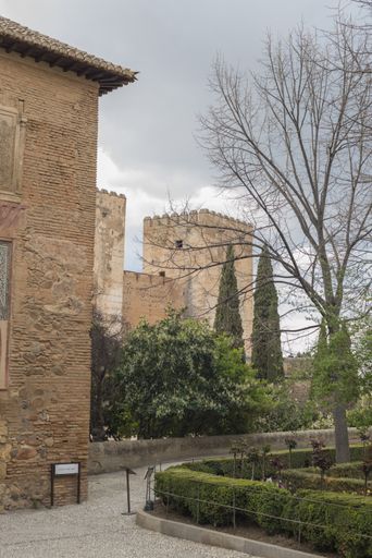 A vertical shot of an ancient building of the Alhambra of Granada, Andalucia, Spain