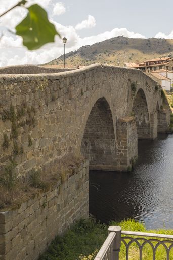 a vertical shot of a bridge over the river in Barco Avila Castilla la Mancha Spain